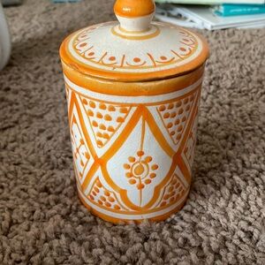 Like new. Handmaid pottery container with lid. No chips.
